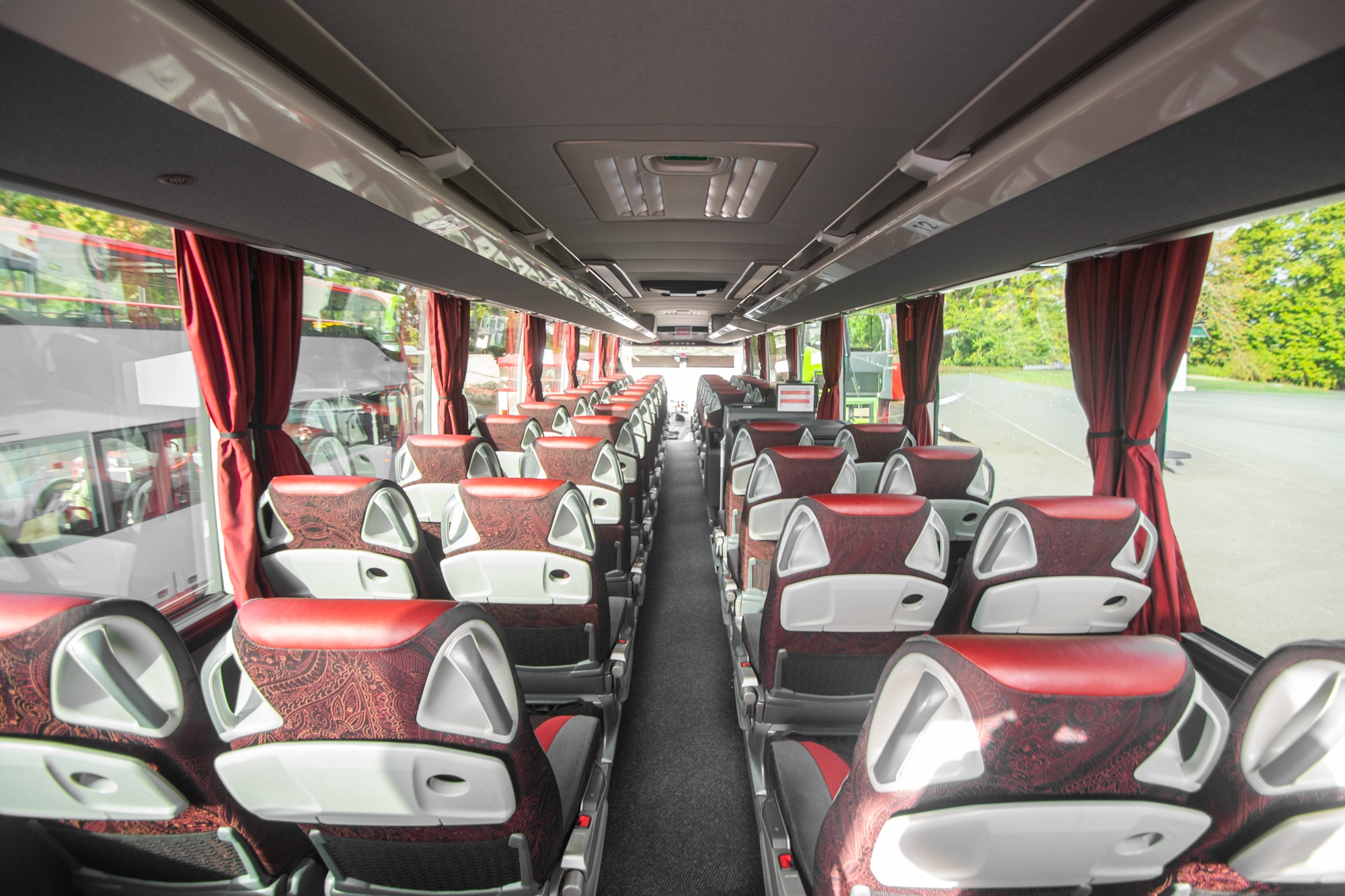 L-Class interior: view along the centre aisle with red curtains