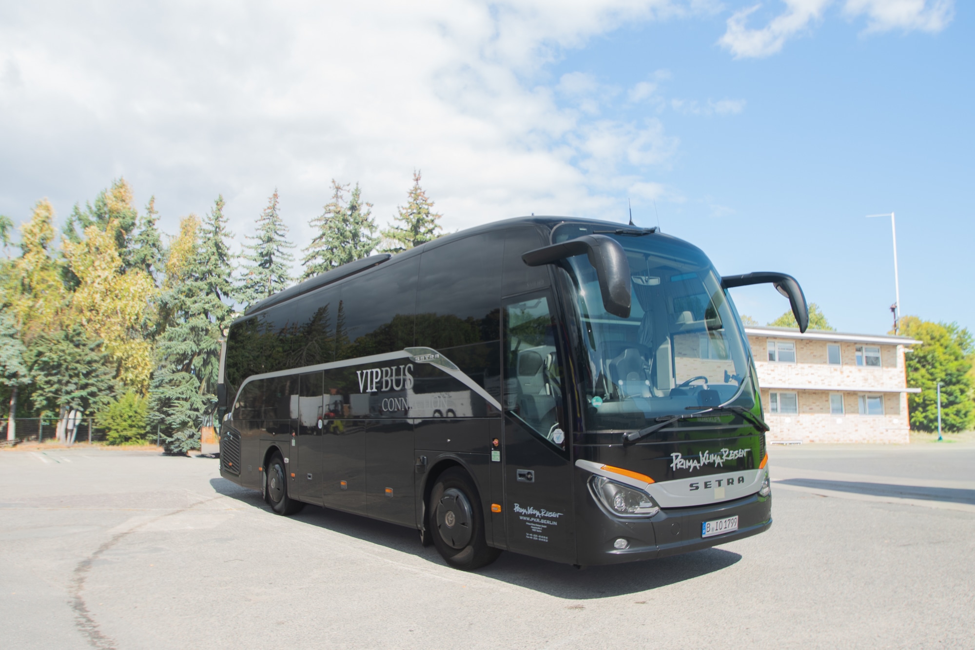Black M-Class bus from the outside