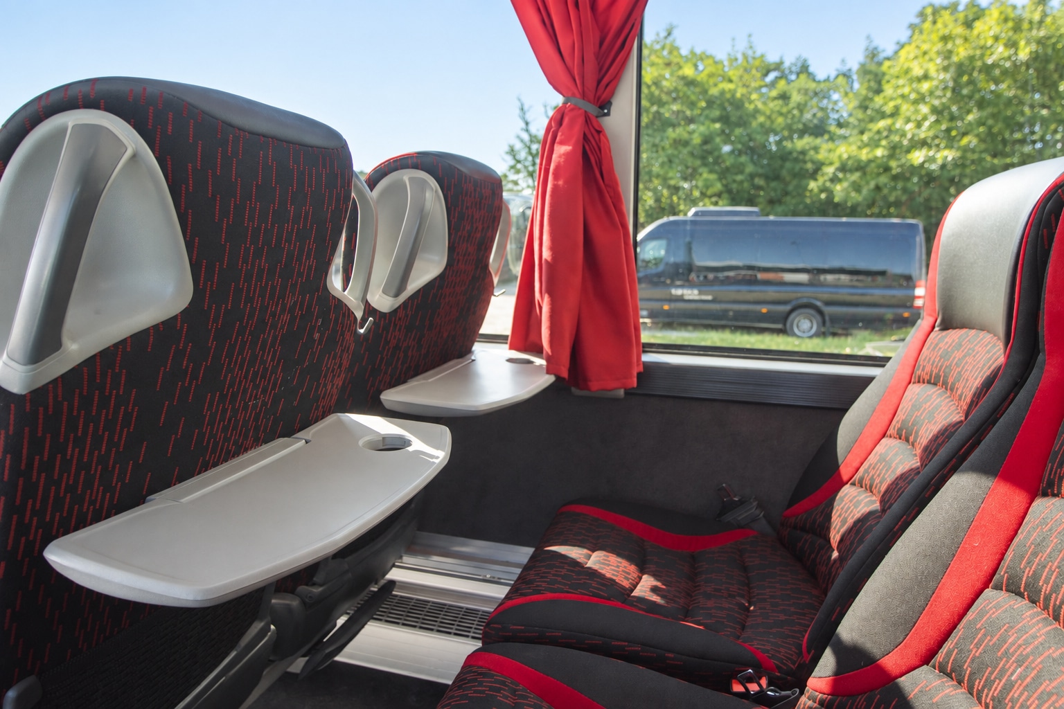 BR Volleys team coach interior: seat with folding table by the window