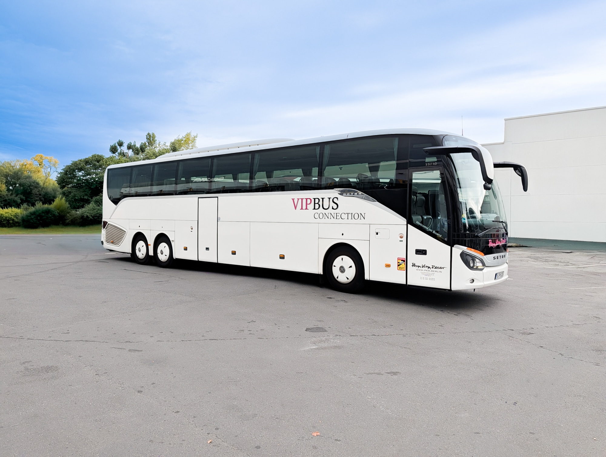 White XL-Class coach from the outside